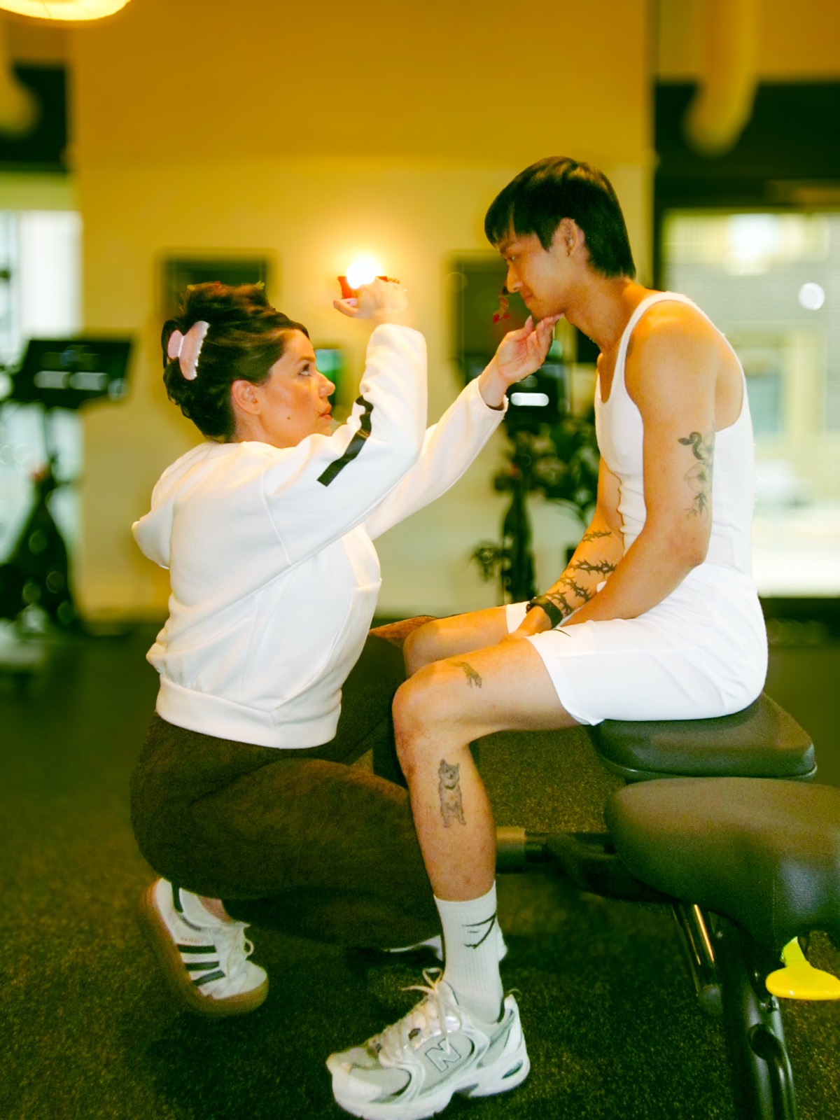 Maria Elena Cismarescu guiding a seated athlete through a visual tracking drill.