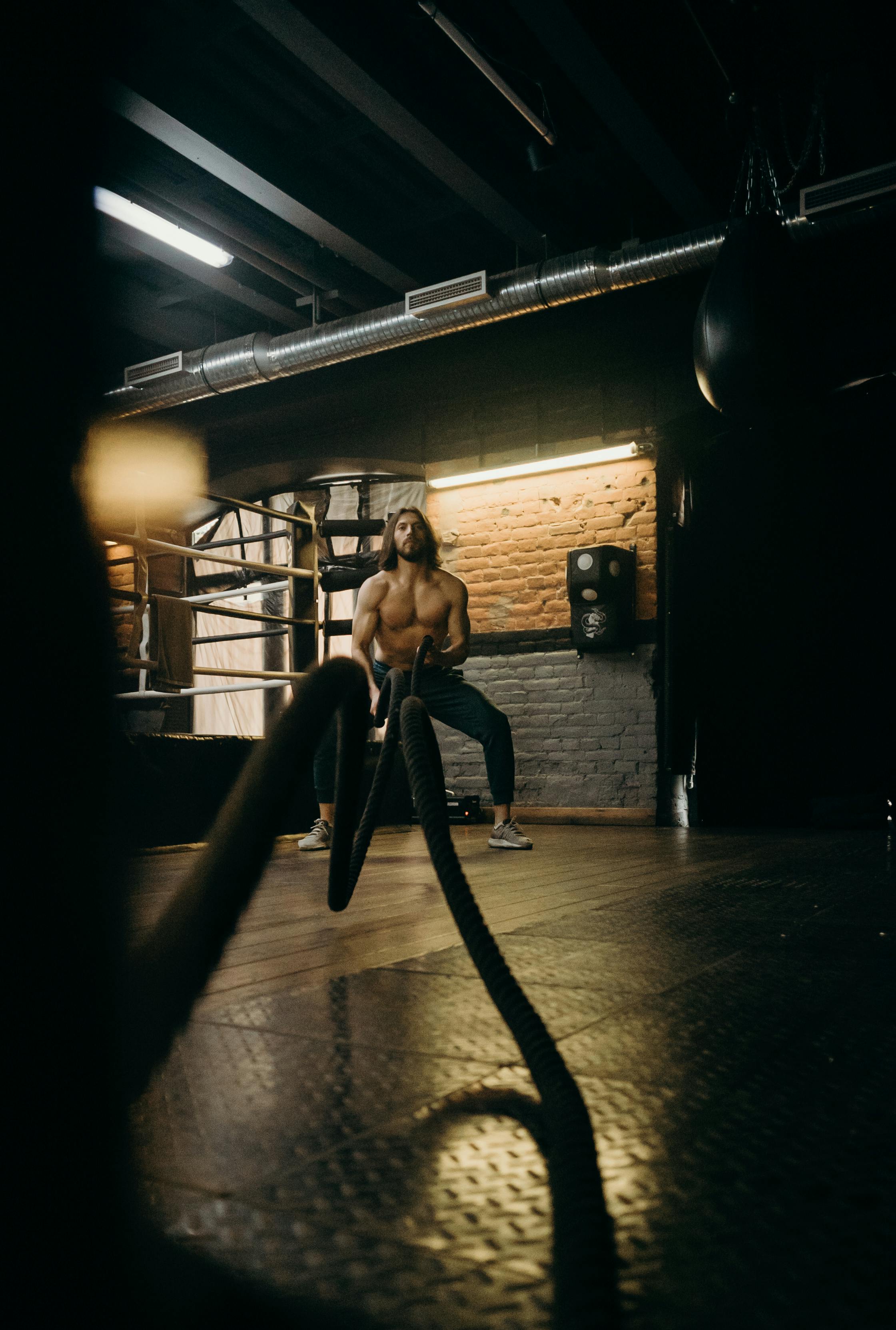 The MAGOCLUB studio interior — warm tungsten light over brick, mid-session.